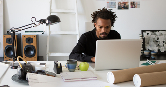 Architect working on computer at his home office