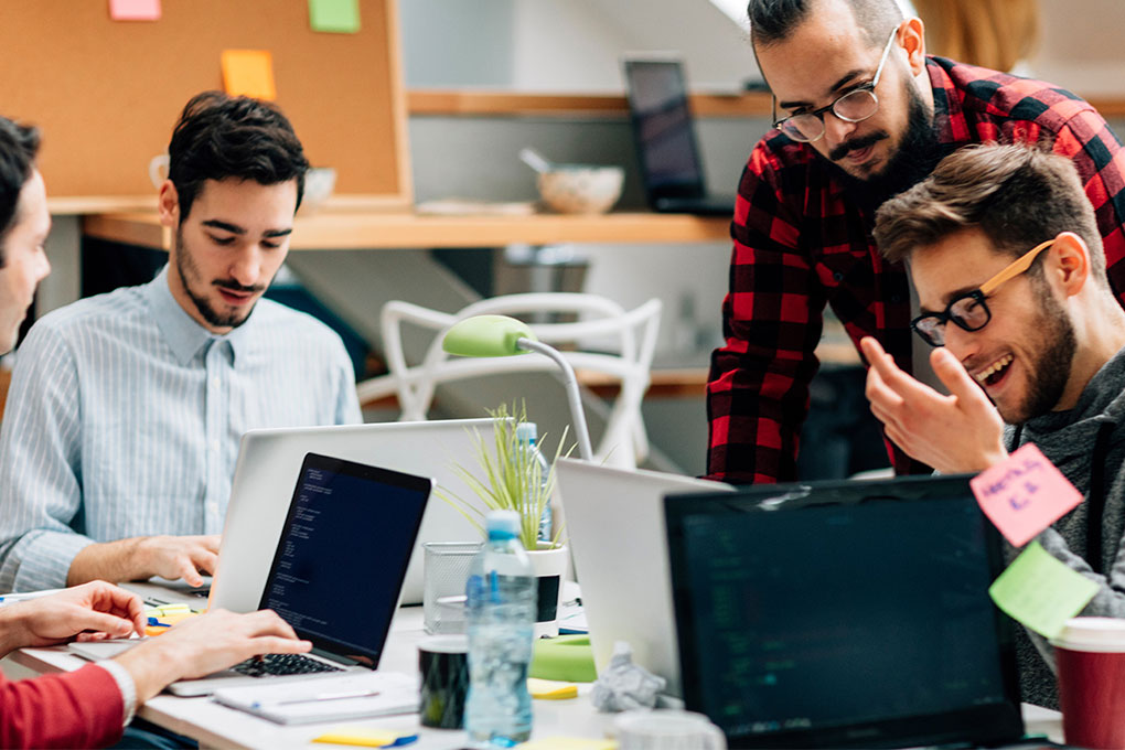 Development Team Cooperating In Their Office. How to incorporate your business in 7 steps