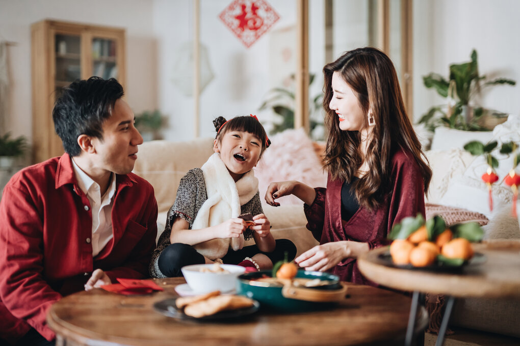 Parents and their child smiling